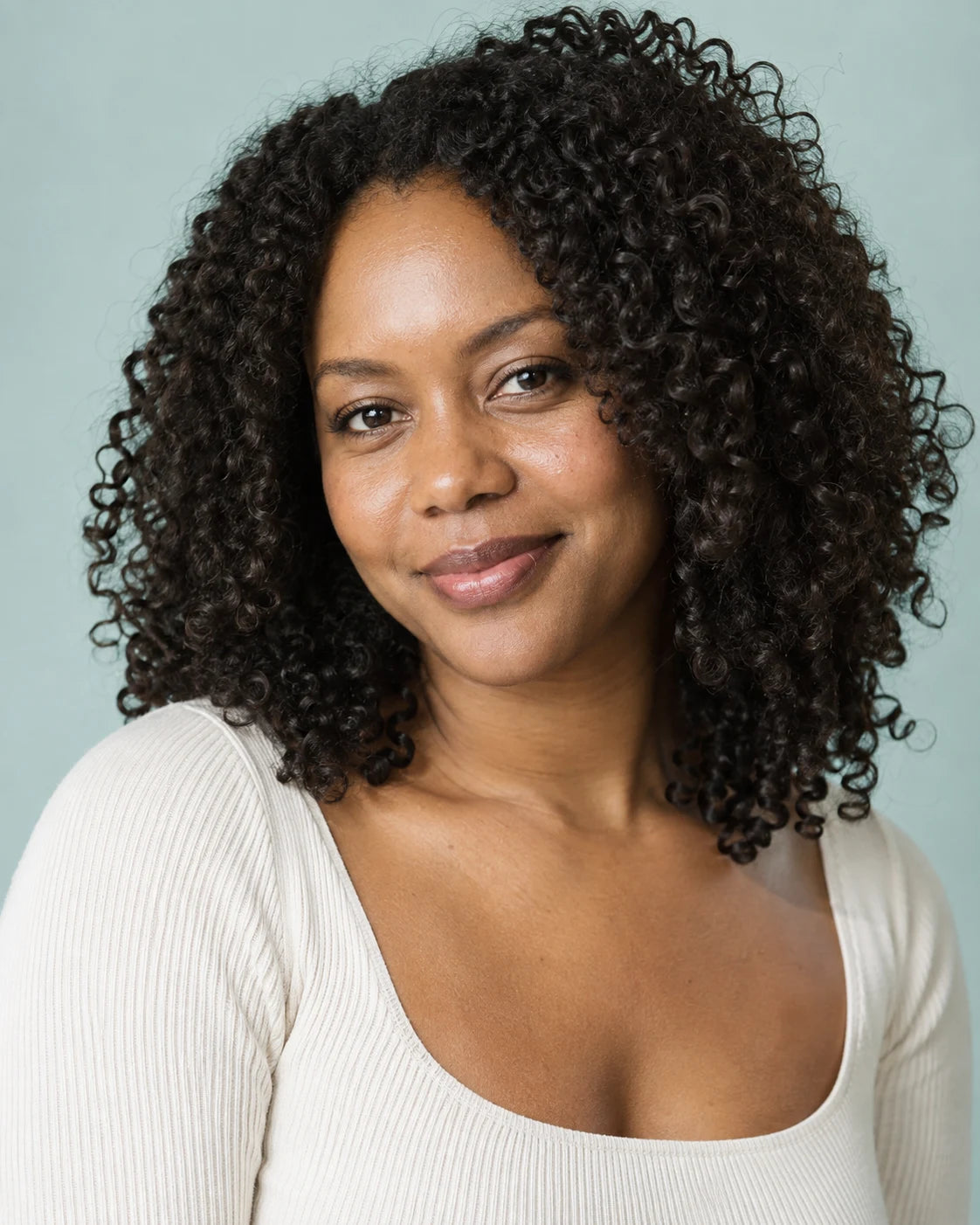 Illustrative portrait of a woman with natural dark curls